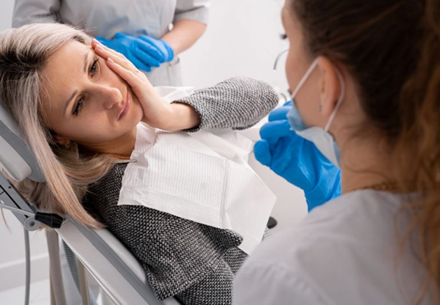 Concerned dental patient talking with her care team